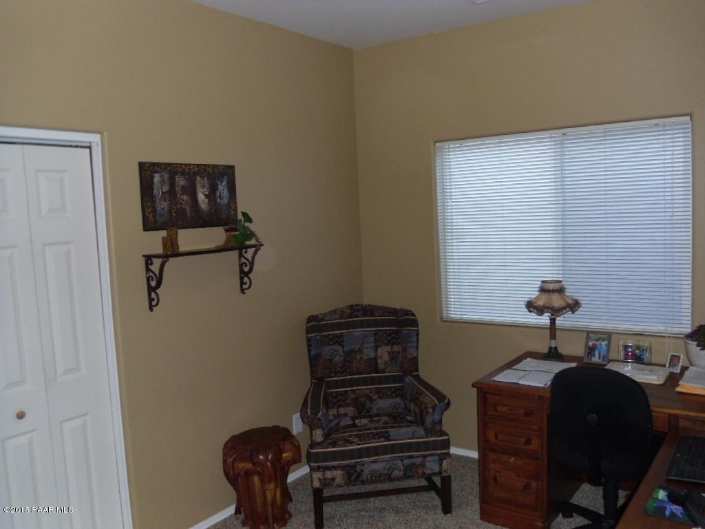1808 Ryan Prescott, AZ 86301 - Photo 3 of 13 a blue chair sitting in a bathroom next to a window