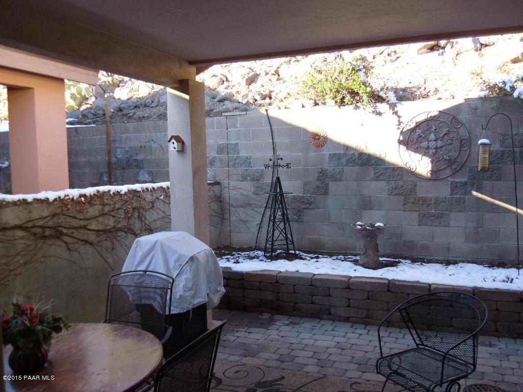 1808 Ryan Prescott, AZ 86301 - Photo 6 of 13 a bathroom with a granite countertop sink a toilet and bathtub