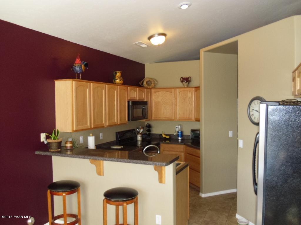 1808 Ryan Prescott, AZ 86301 - Photo 8 of 13 a kitchen with stainless steel appliances granite countertop a refrigerator a stove and a sink
