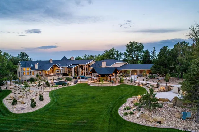 an aerial view of a house with outdoor space swimming pool