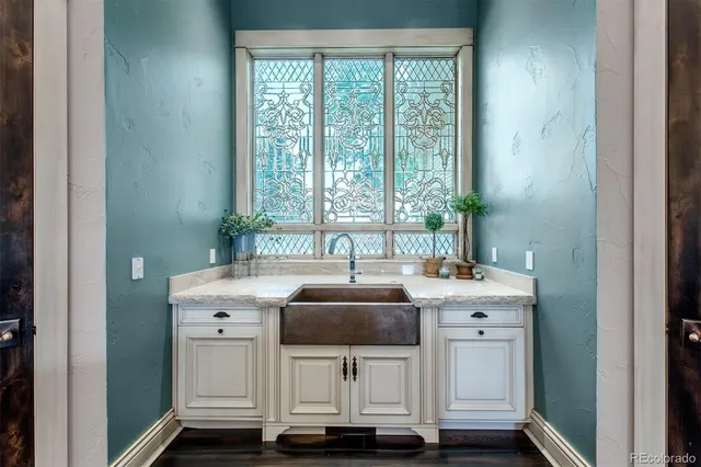 a kitchen with a sink and cabinets