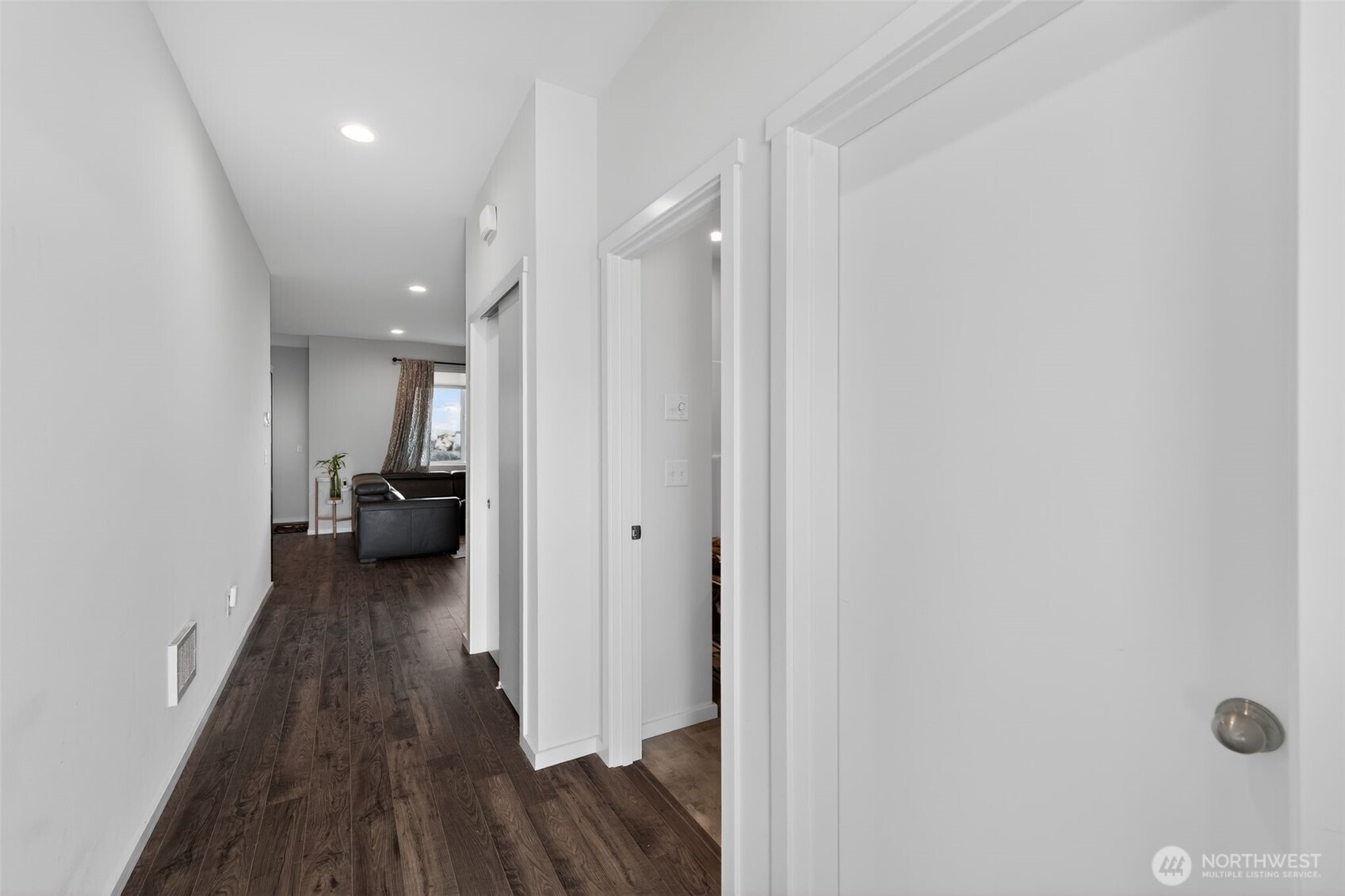 2134 Riverstone Loop Ferndale, WA 98248 - Photo 12 of 35 a view of a hallway with a livingroom with furniture and wooden floor
