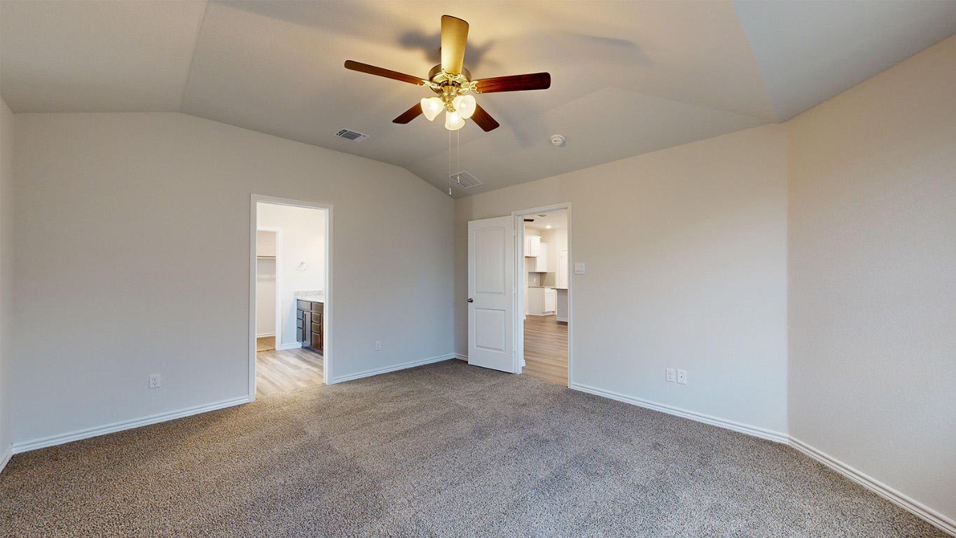 305 Creekfall Road Burnet, TX 78611 - Photo 12 of 33 an empty room with ceiling fan and window