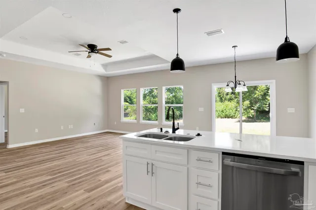 a kitchen with a sink and window