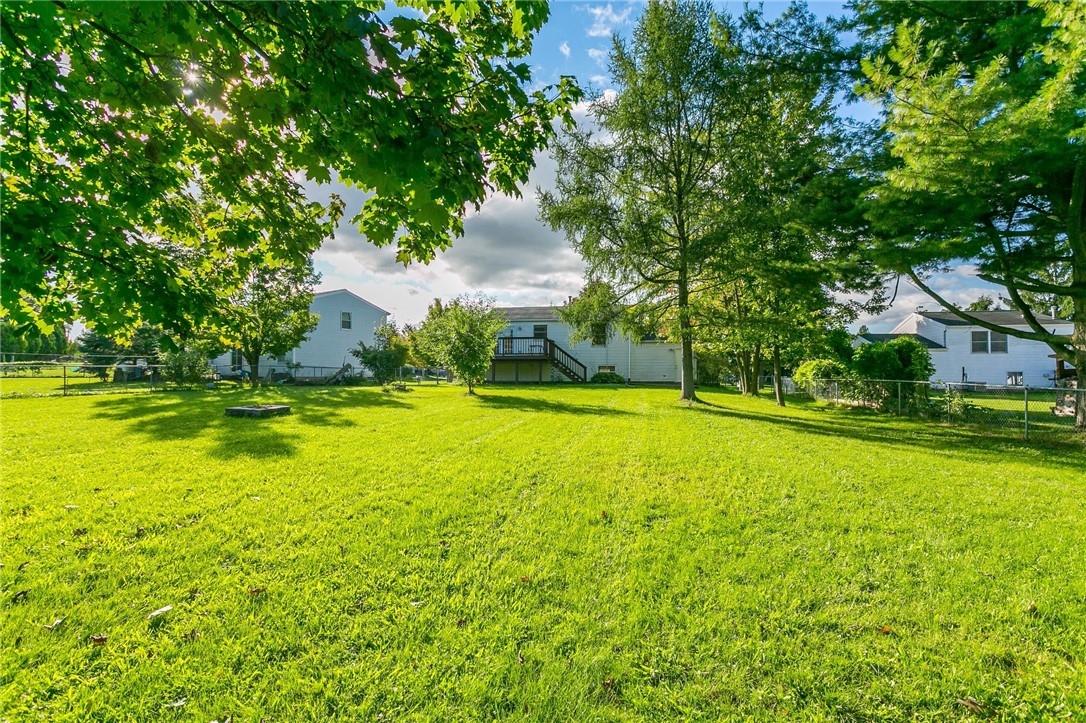 14 Prairie Trail Henrietta, NY 14586 - Photo 20 of 20 View from the backyard looking back at the house
