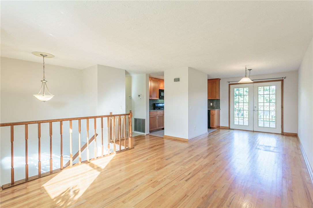 14 Prairie Trail Henrietta, NY 14586 - Photo 3 of 20 second floor living room with wood floors and Fren