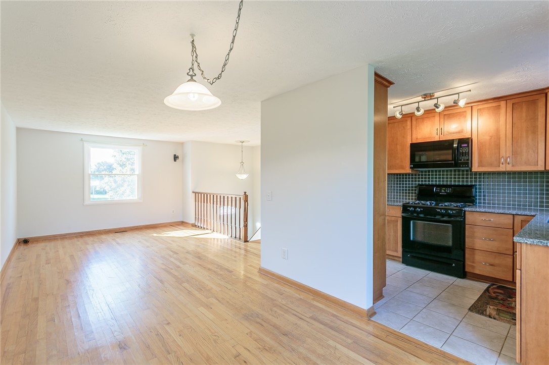 14 Prairie Trail Henrietta, NY 14586 - Photo 4 of 20 Living/Dining room connects to kitchen