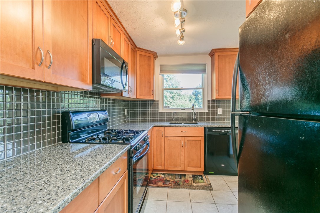 14 Prairie Trail Henrietta, NY 14586 - Photo 6 of 20 sink under window overlooking large backyard