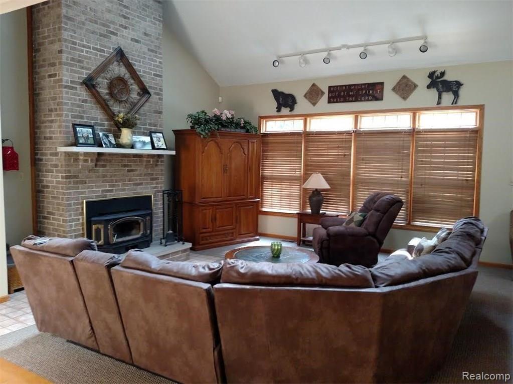 226 Wadhams Road St. Clair, MI 48079 - Photo 10 of 29 Large living room, fireplace with wood burning insert