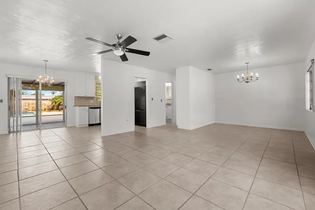 a view of a kitchen with a sink and a window