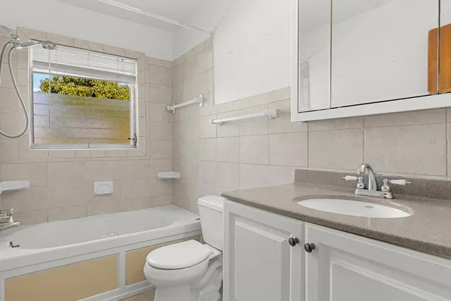 a bathroom with a sink toilet and bathtub