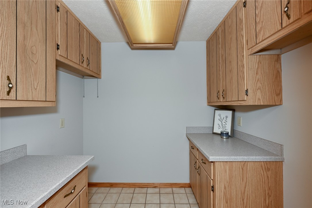 4010 State Road Medina, OH 44256 - Photo 18 of 50 Washroom featuring baseboards and light tile patterned flooring