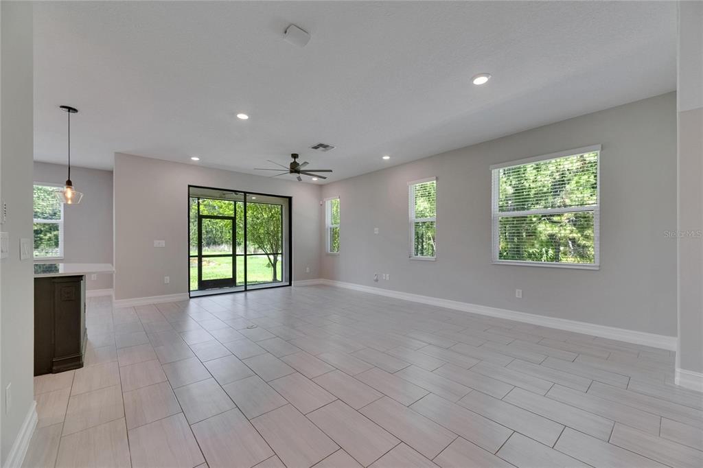 4899 Isola Court Wesley Chapel, FL 33543 - Photo 27 of 86 an empty room with windows