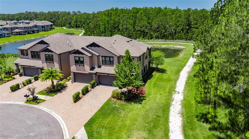 4899 Isola Court Wesley Chapel, FL 33543 - Photo 3 of 86 an aerial view of a house