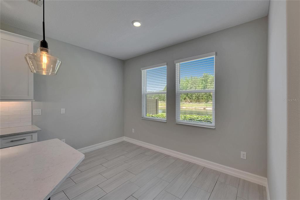 4899 Isola Court Wesley Chapel, FL 33543 - Photo 39 of 86 a view of a room with a windows and ceiling fan