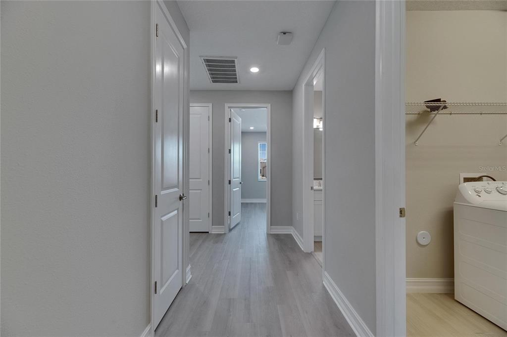 4899 Isola Court Wesley Chapel, FL 33543 - Photo 69 of 86 a view of a room with wooden floor