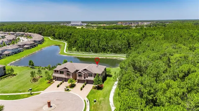 an aerial view of a house with a garden