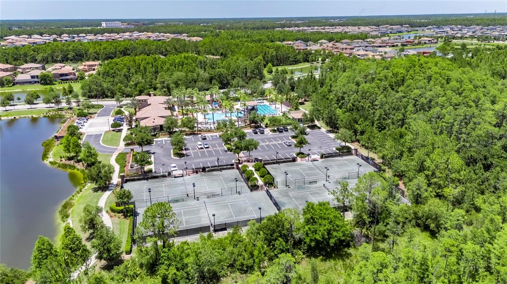 4899 Isola Court Wesley Chapel, FL 33543 - Photo 83 of 86 an aerial view of a house with a yard lake view