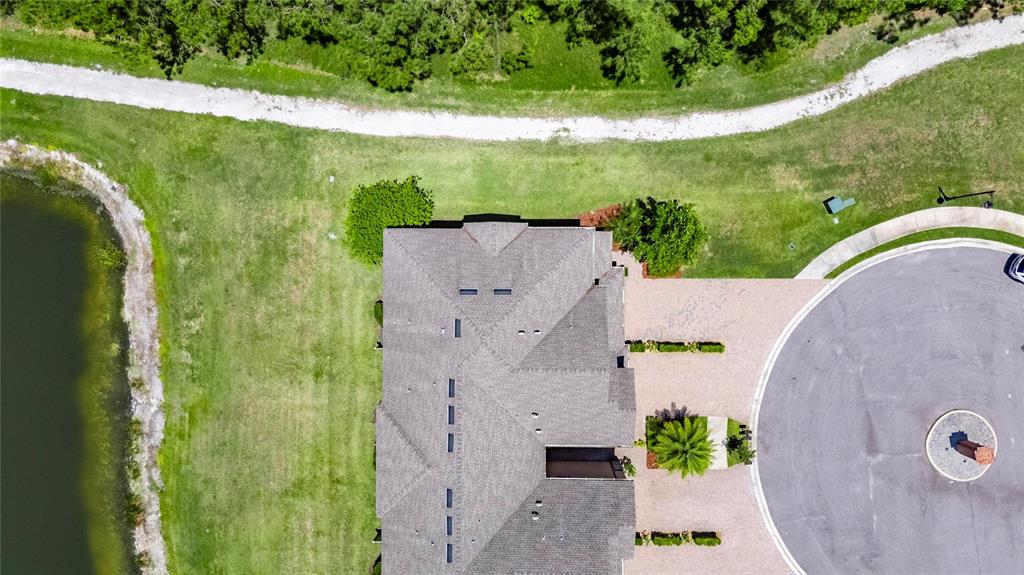 4899 Isola Court Wesley Chapel, FL 33543 - Photo 10 of 86 an aerial view of a house with a garden
