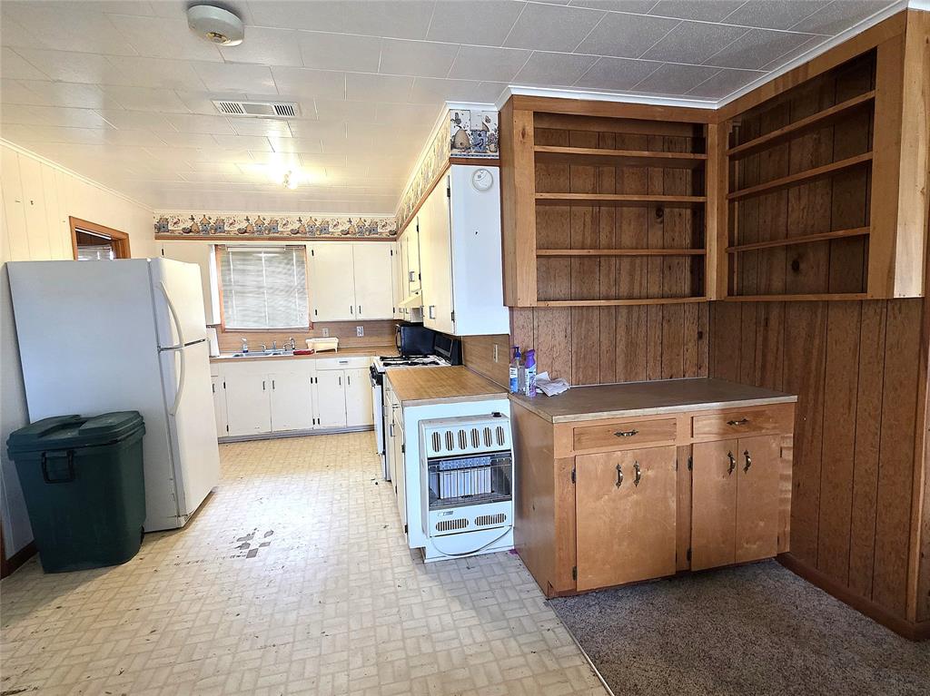 3049 Highway 507 Coushatta, LA 71019 - Photo 11 of 39 a kitchen with a refrigerator and a sink