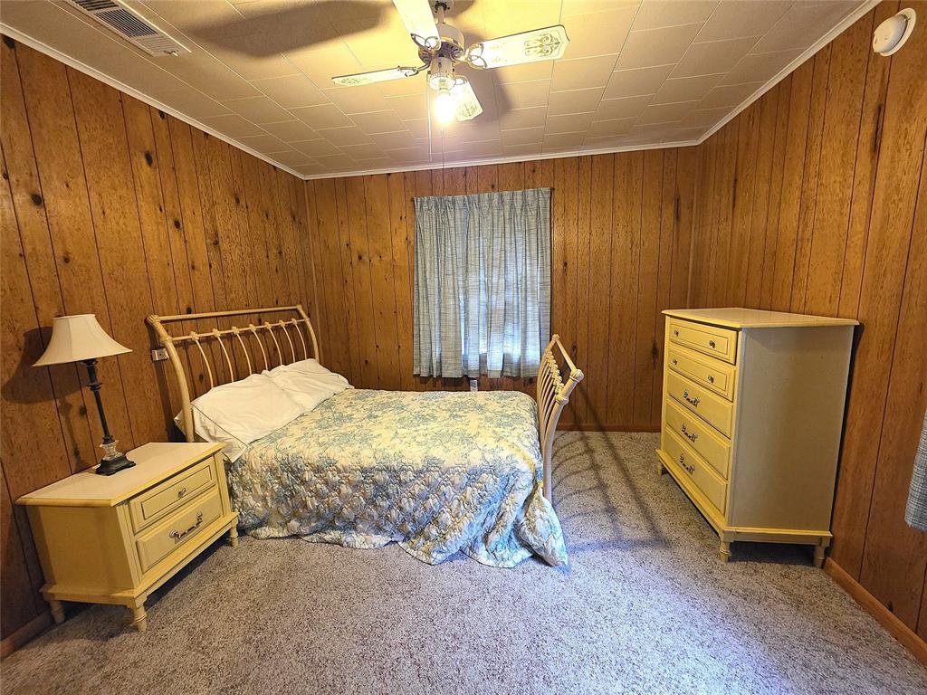 3049 Highway 507 Coushatta, LA 71019 - Photo 17 of 39 a bedroom with a bed and a mirror
