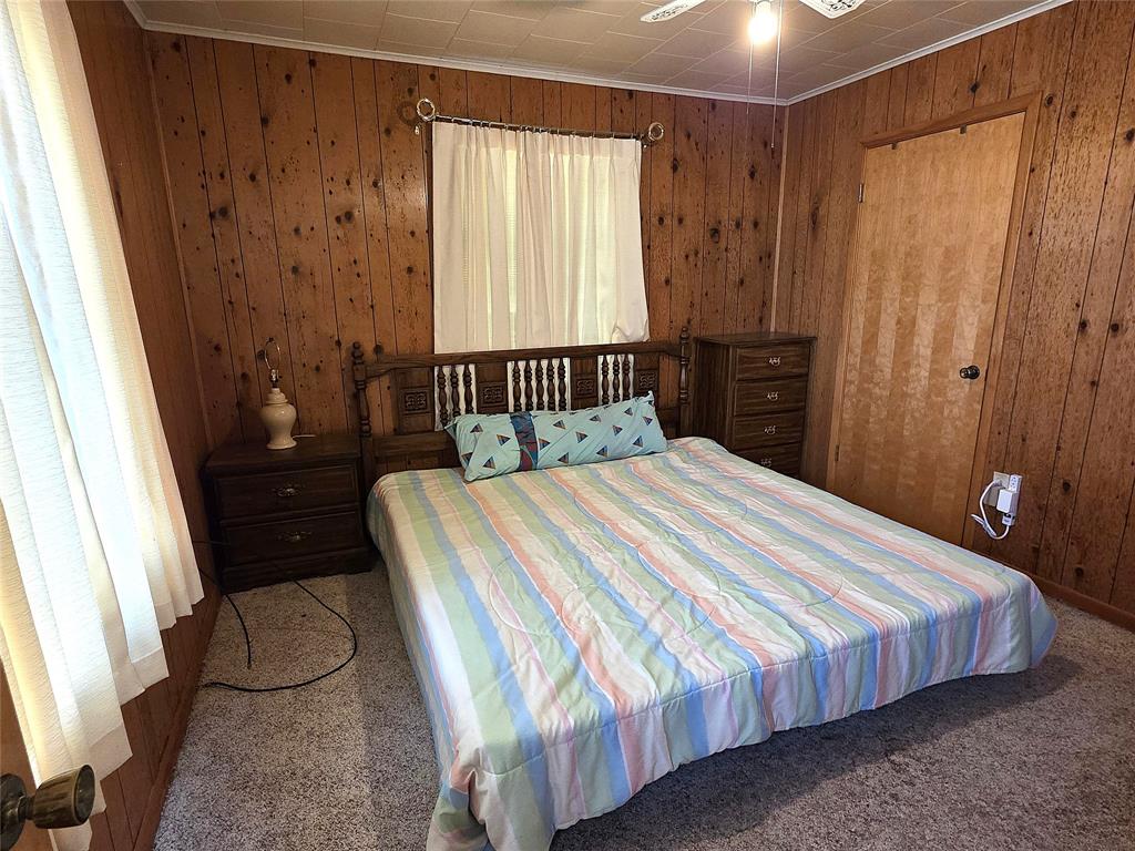 3049 Highway 507 Coushatta, LA 71019 - Photo 20 of 39 a bedroom with a bed and dresser with shower