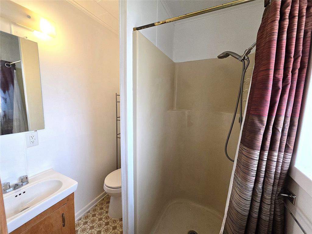 3049 Highway 507 Coushatta, LA 71019 - Photo 21 of 39 a bathroom with a shower toilet and sink