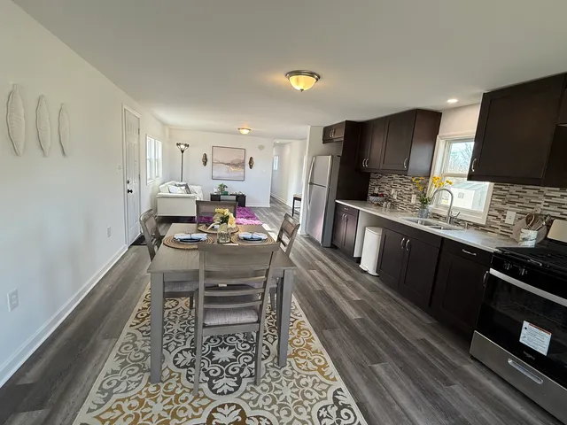 a kitchen with a dining table and chairs