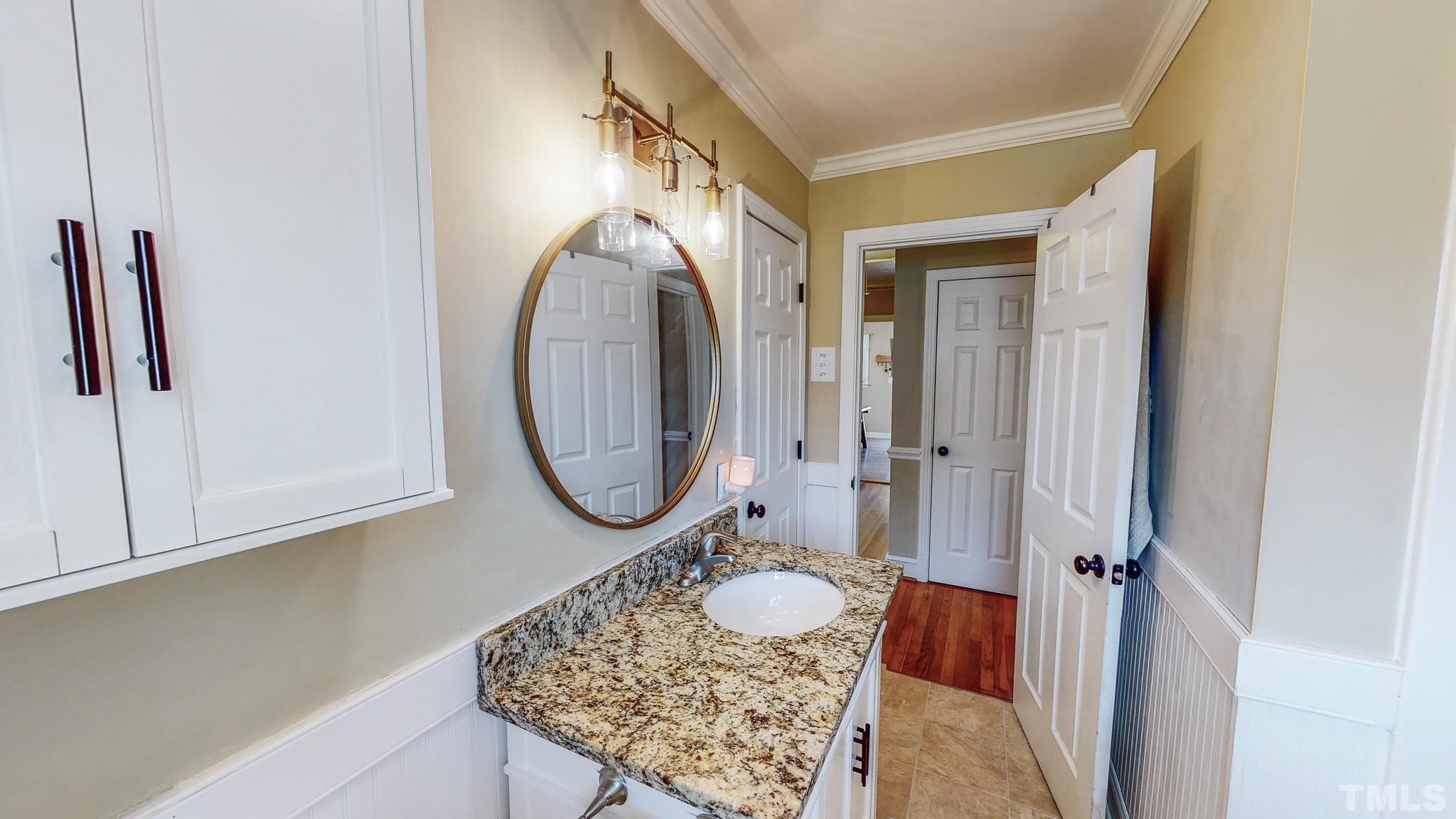 650 Younger Roxboro, NC 27573 - Photo 23 of 42 a bathroom with a sink a mirror and a toilet