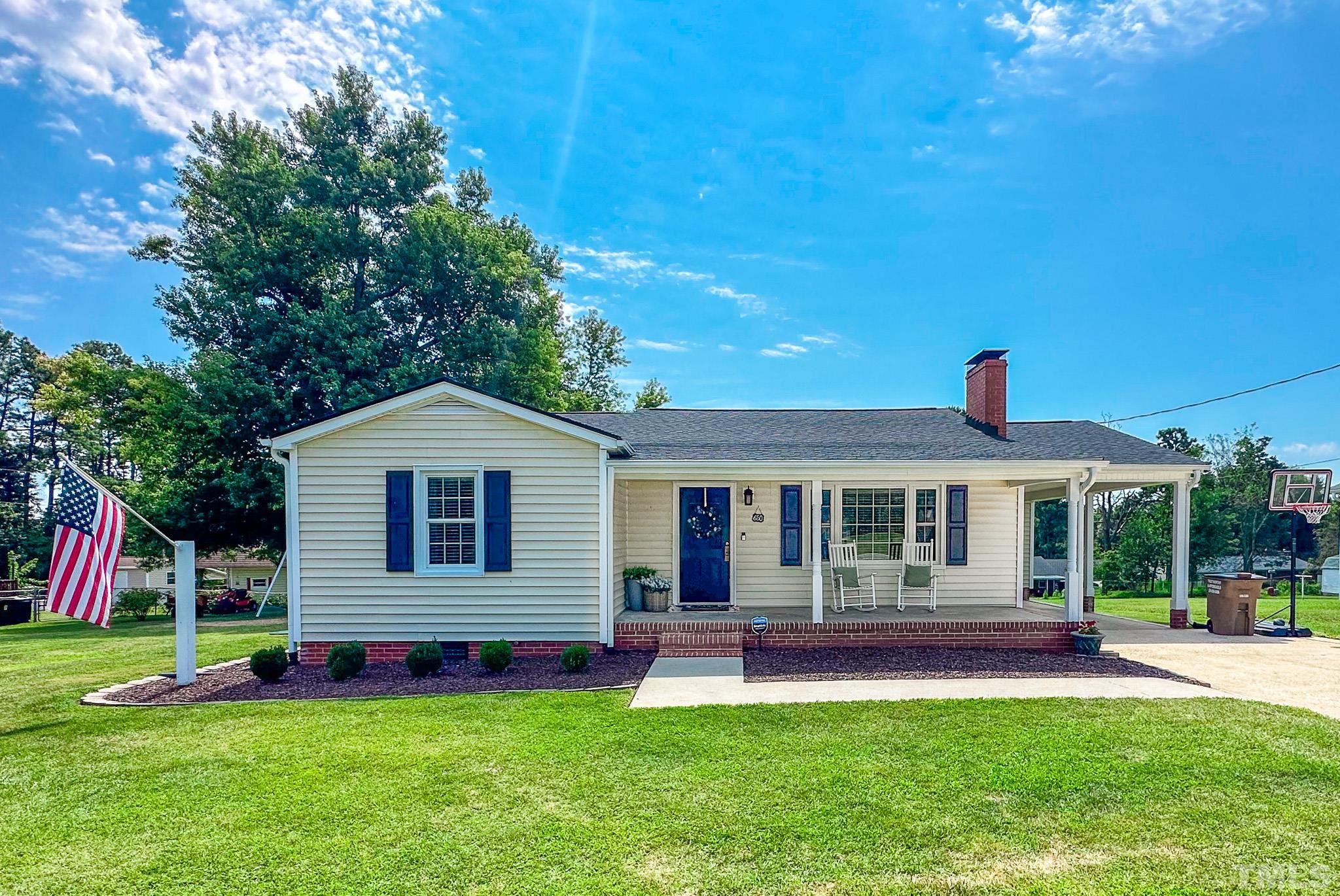 650 Younger Roxboro, NC 27573 - Photo 24 of 42 a front view of a house with a yard and porch