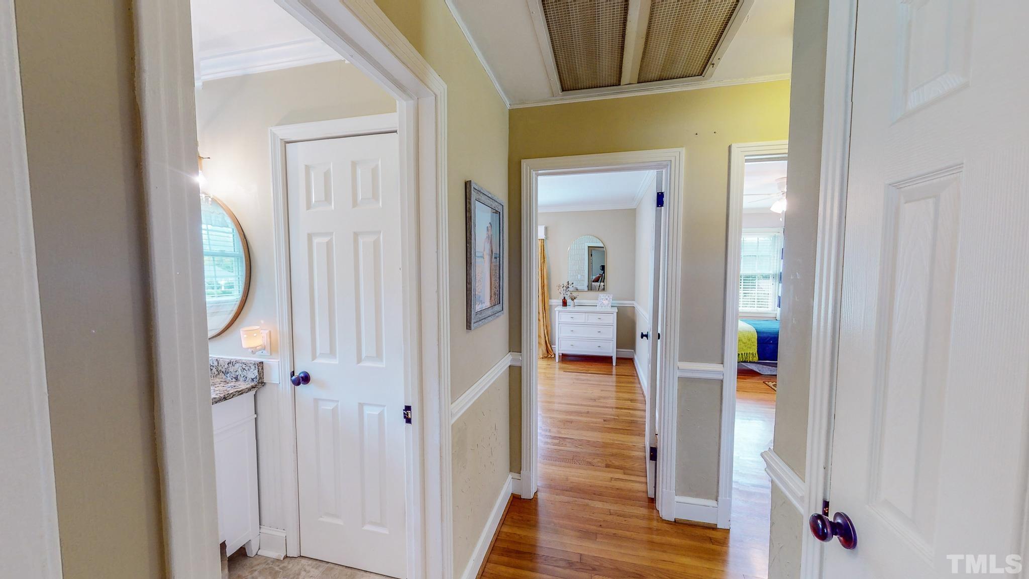 650 Younger Roxboro, NC 27573 - Photo 25 of 42 a view of a hallway with wooden floor and dining room