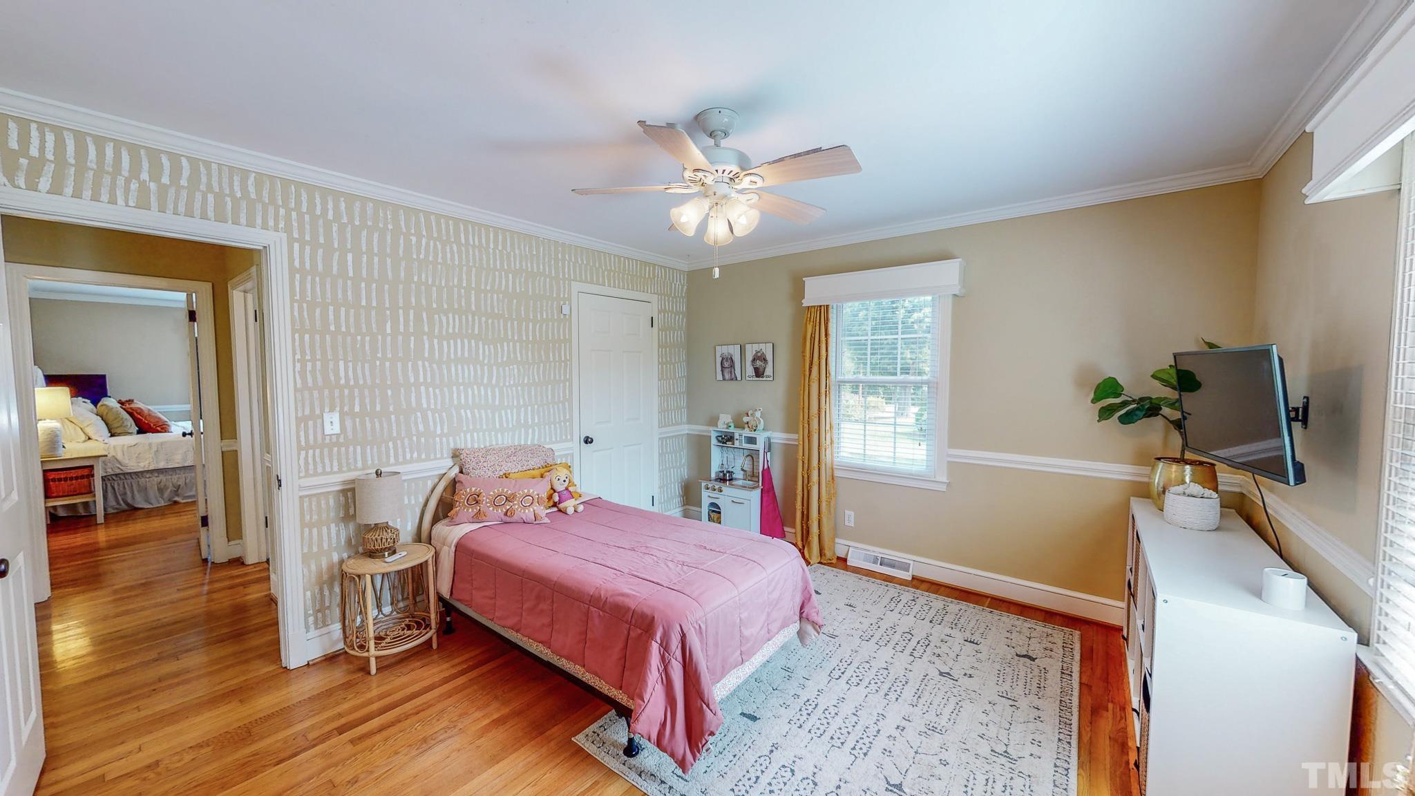 650 Younger Roxboro, NC 27573 - Photo 27 of 42 a bedroom with a bed and wooden floor