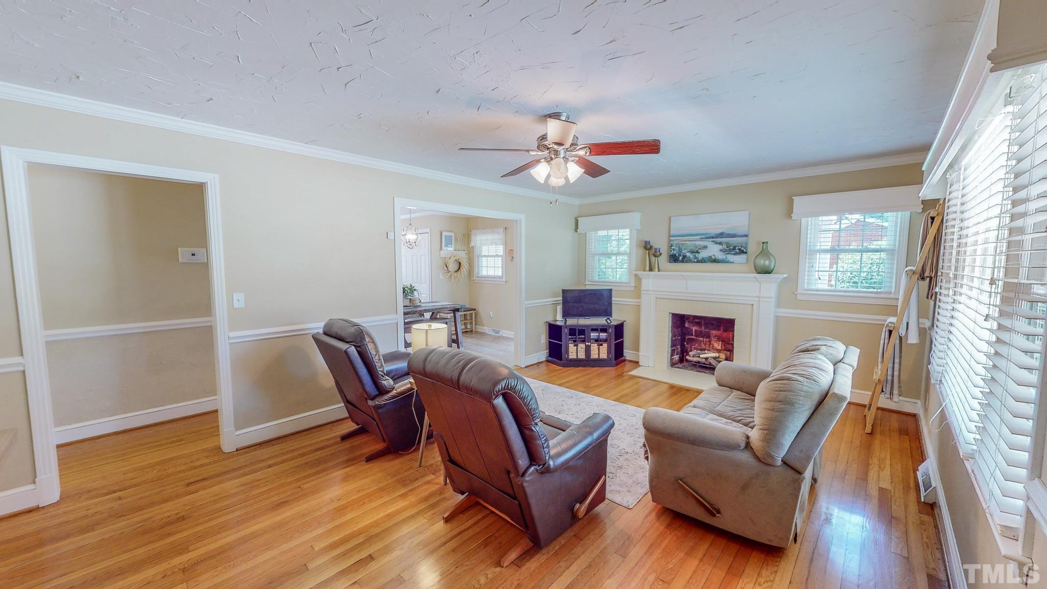 650 Younger Roxboro, NC 27573 - Photo 8 of 42 a living room with furniture a fireplace and a window