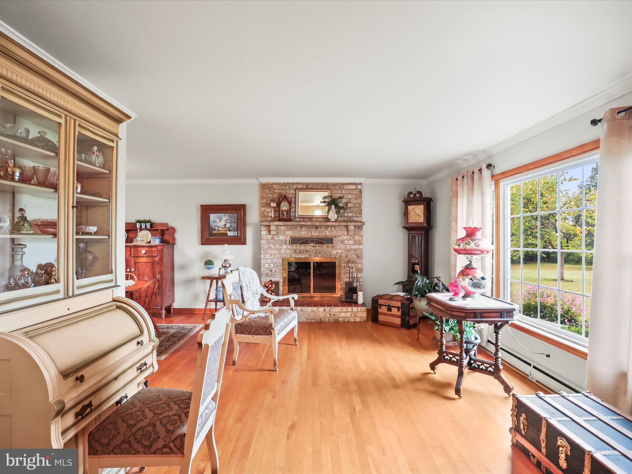 3211 Centennial Road Hanover, PA 17331 - Photo 19 of 70 a living room with furniture a fireplace and floor to ceiling windows