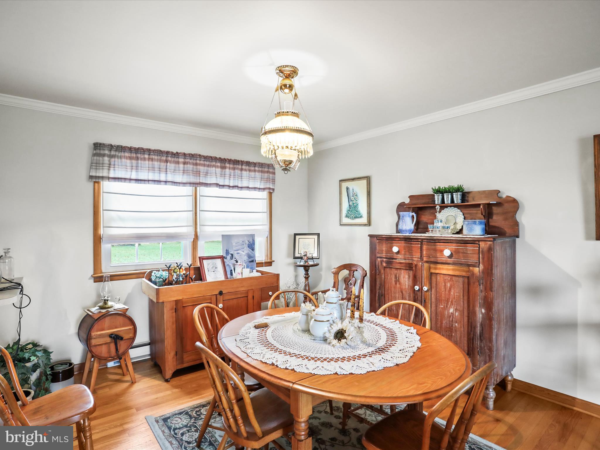 3211 Centennial Road Hanover, PA 17331 - Photo 20 of 70 a dining room with furniture a chandelier and wooden floor