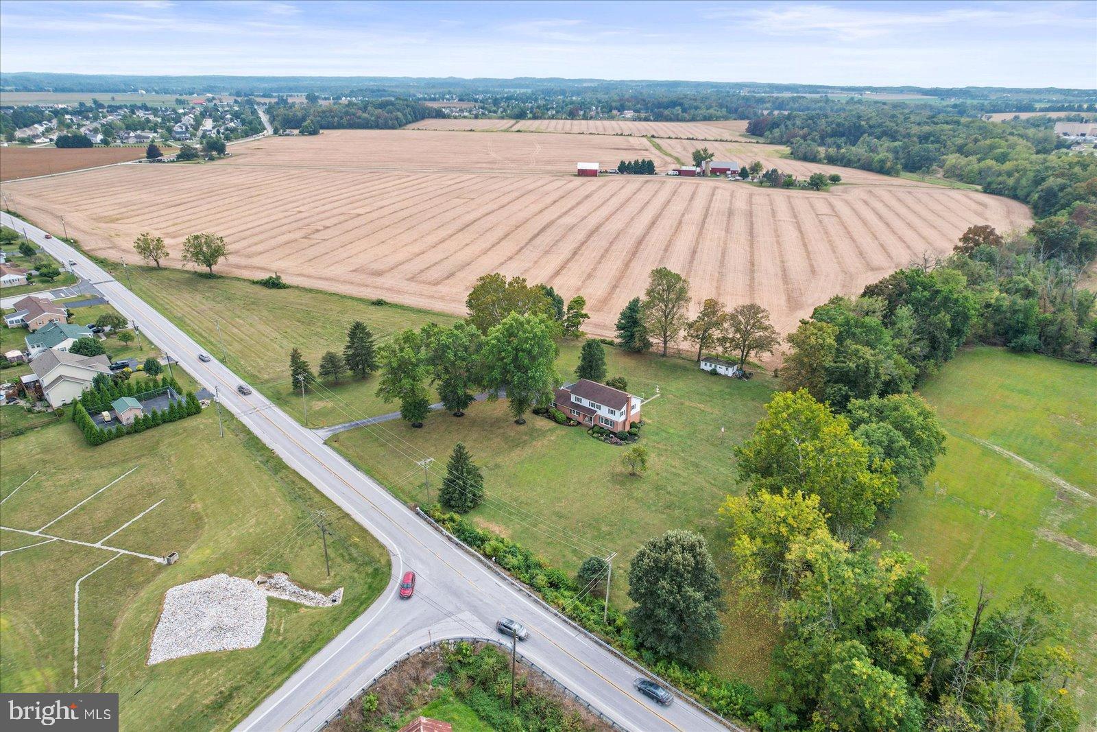 3211 Centennial Road Hanover, PA 17331 - Photo 2 of 70 a view of a backyard with plants and lake view