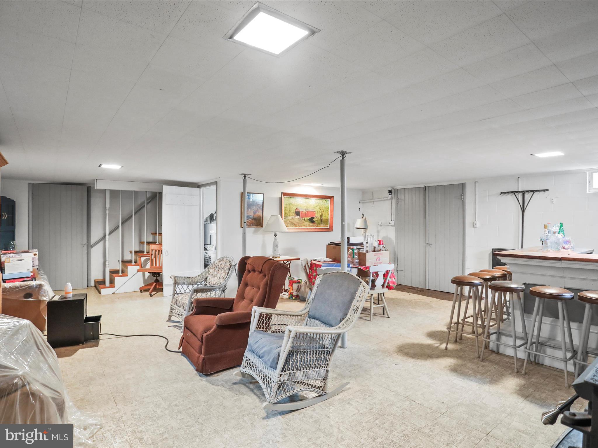 3211 Centennial Road Hanover, PA 17331 - Photo 37 of 70 a living room with furniture a dining table and chairs with wooden floor