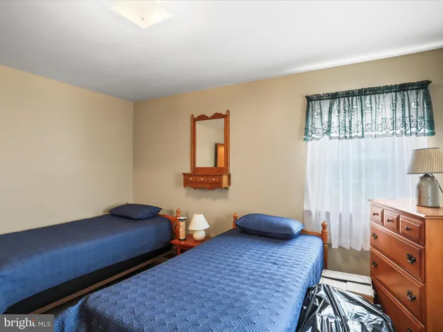 a view of yard with swimming pool and green space