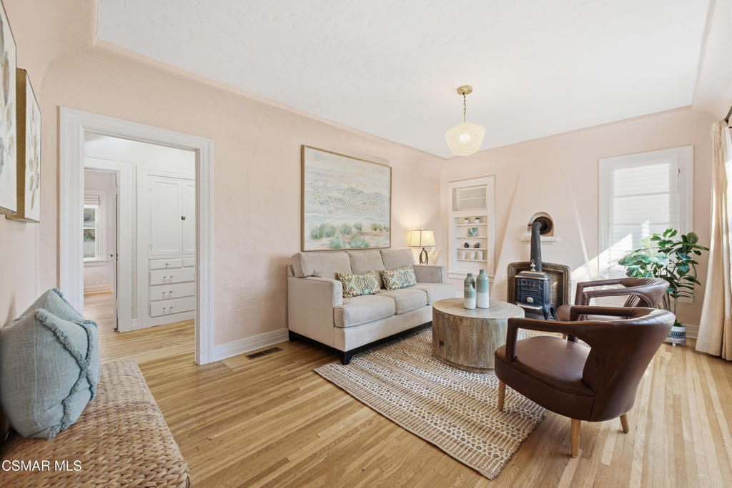9160 Huston Road Chatsworth, CA 91311 - Photo 11 of 32 a living room with furniture and a chandelier
