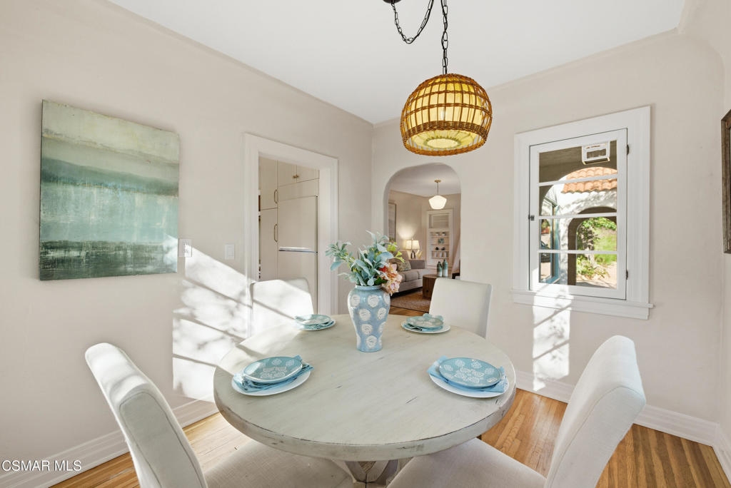 9160 Huston Road Chatsworth, CA 91311 - Photo 13 of 32 a dining room with furniture a wooden floor and a table