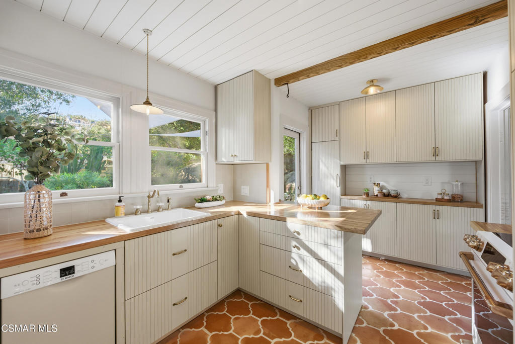 9160 Huston Road Chatsworth, CA 91311 - Photo 2 of 32 a kitchen with a sink stove and window