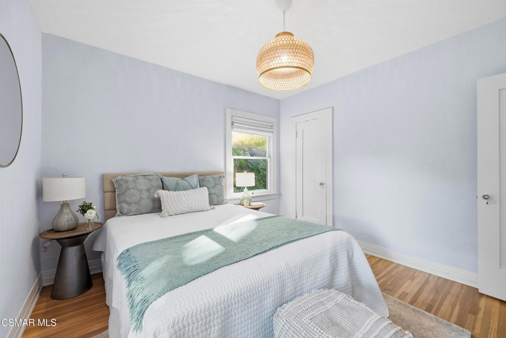 9160 Huston Road Chatsworth, CA 91311 - Photo 21 of 32 a bedroom with a bed and a window