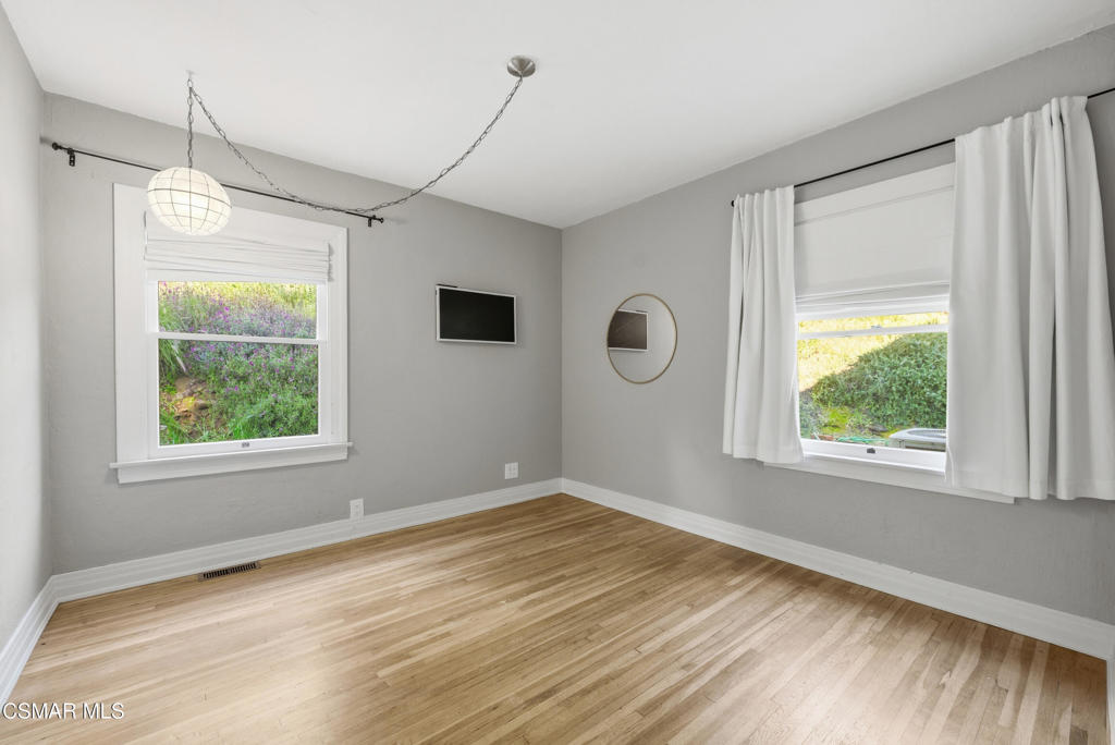 9160 Huston Road Chatsworth, CA 91311 - Photo 23 of 32 a view of empty room with wooden floor and fan