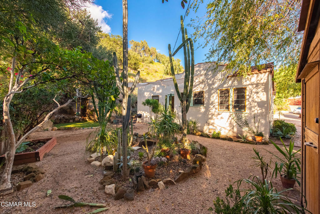 9160 Huston Road Chatsworth, CA 91311 - Photo 28 of 32 a view of a yard with plants and trees