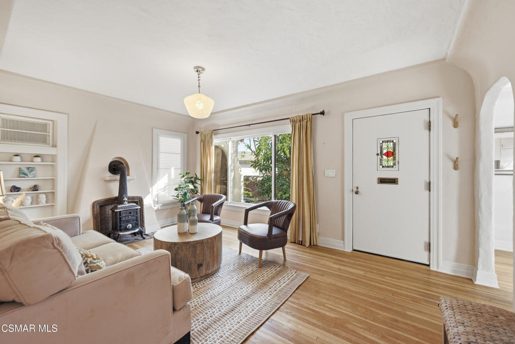 9160 Huston Road Chatsworth, CA 91311 - Photo 9 of 32 a living room with furniture chandelier and a large window