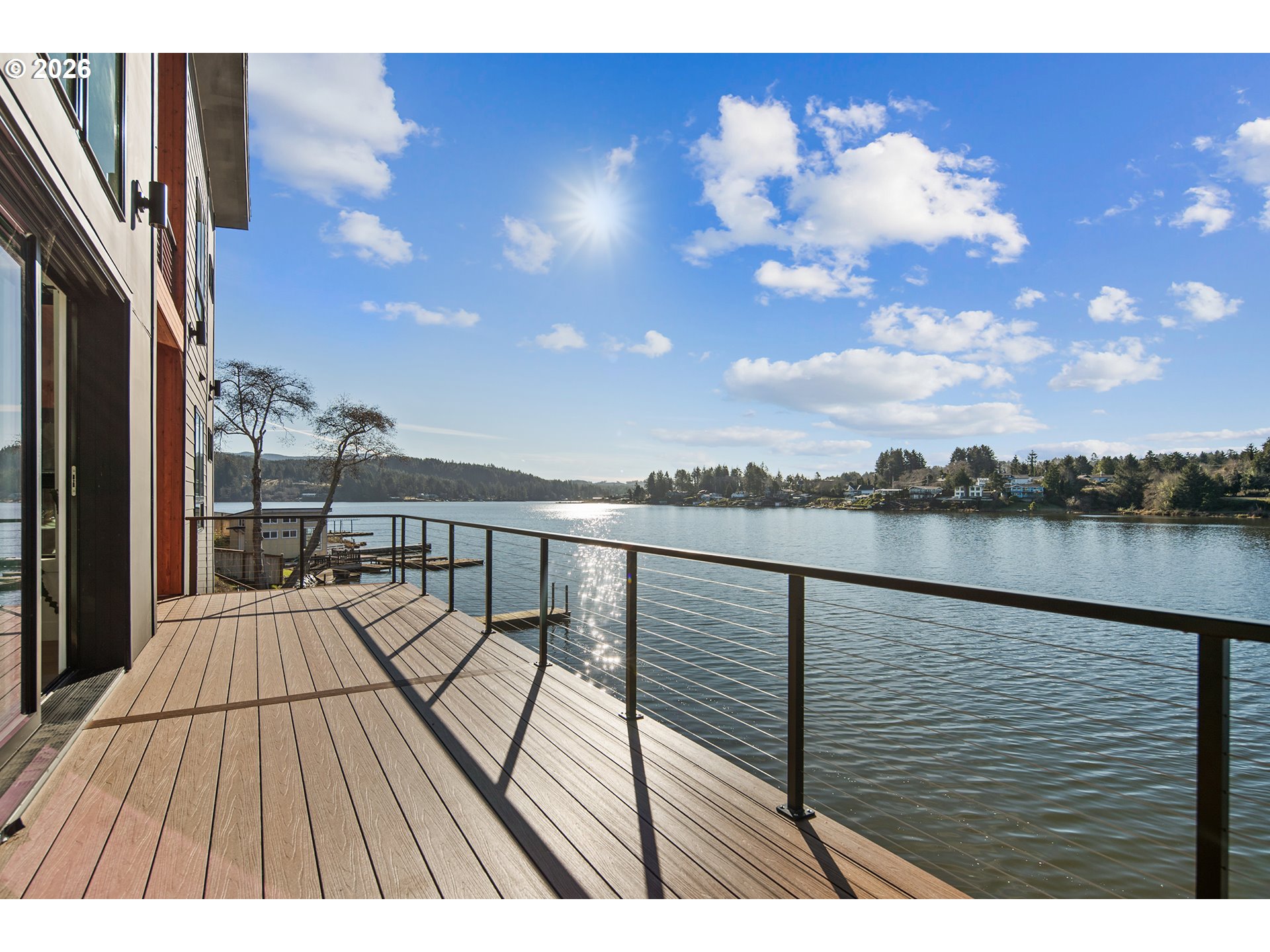3403 Northeast Johns Loop Neotsu, OR 97364 - Photo 16 of 48 a view of roof deck with two chairs and wooden floor