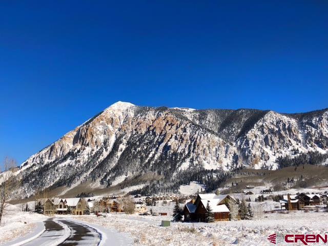 64 Vista Court Crested Butte, CO 81224 - Photo 9 of 12 a view of a building with a yard