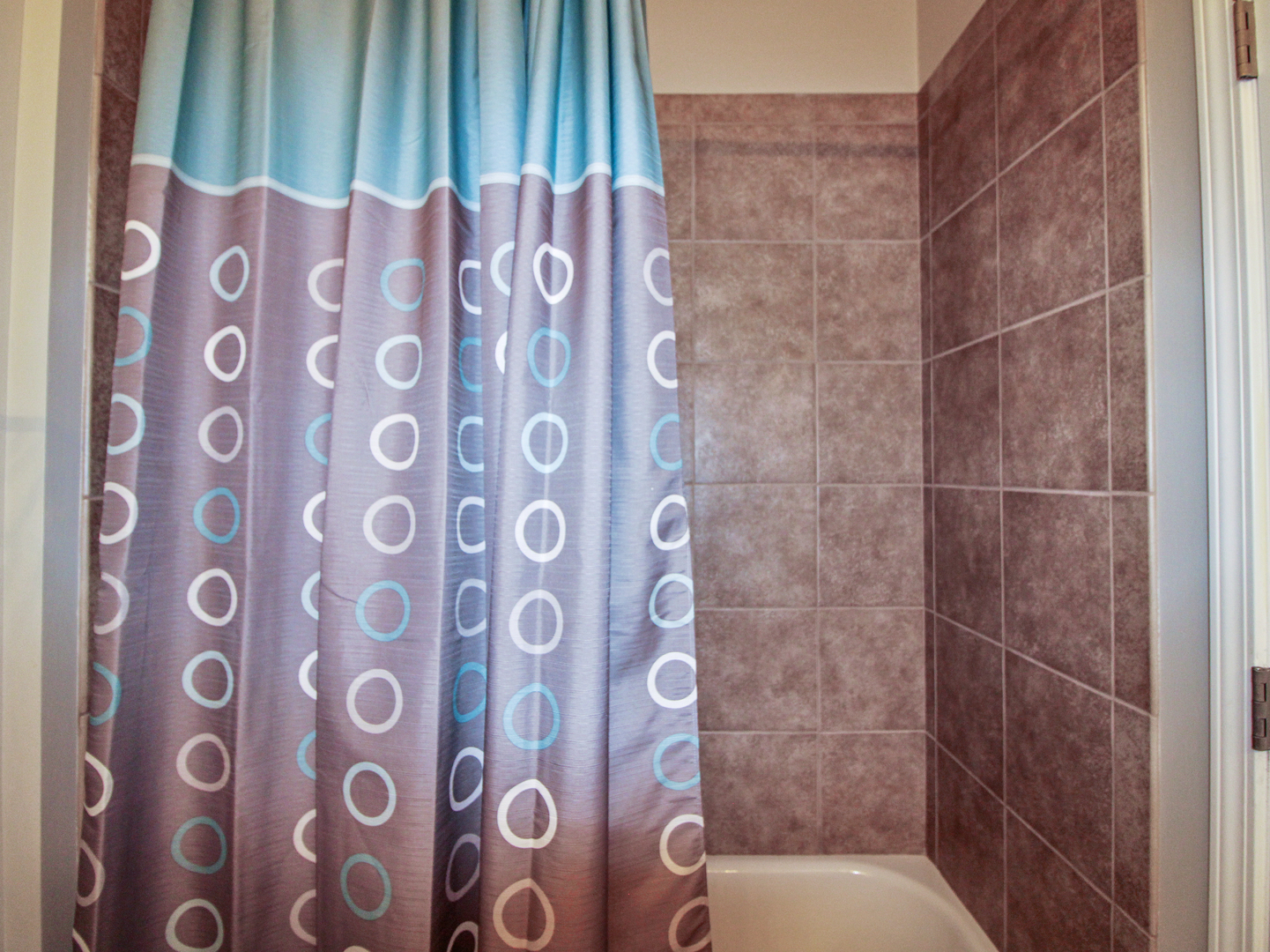 2409 West 32nd Place Chicago, IL 60608 - Photo 13 of 17 a bathroom with a bathtub and shower curtain