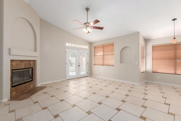 a large white kitchen with granite countertop a stove a sink and a refrigerator
