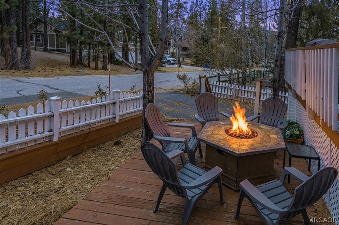 42324 Paramount Road Big Bear Lake, CA 92315 - Photo 14 of 50 a view of balcony with wooden floor and outdoor seating